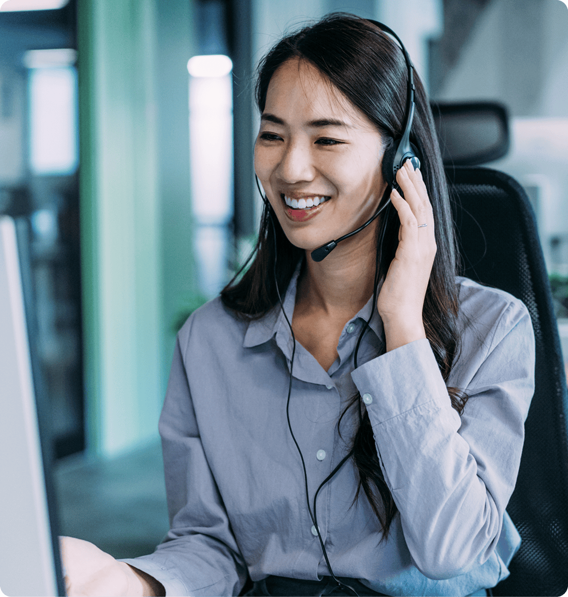 Woman smiling while using a headset.
