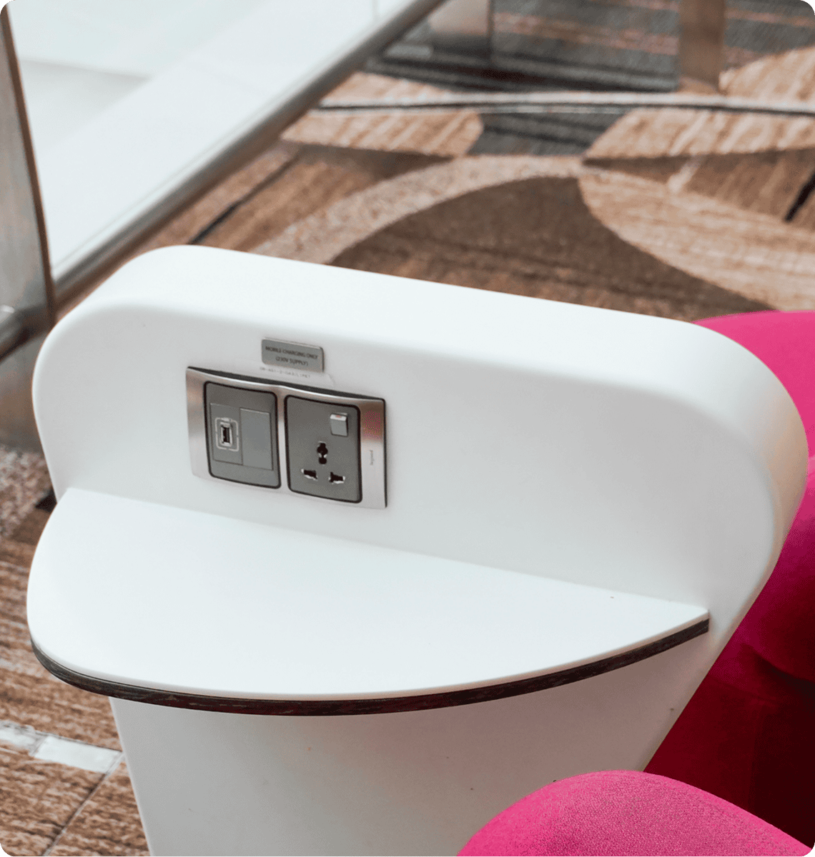 Airport seating with integrated power outlets.